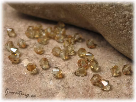 Ljus topaz AB facetterad bicone 25-pack ca 3 mm