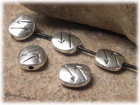 Metallpärla platt oval med pilar 10-pack 11x10 mm