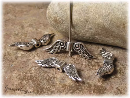 Storpack Änglavingar i platinafärgad metall 30-pack ca 23x7 mm