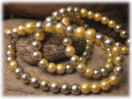 1 sträng vaxad rund 2 färgad silver/gul glaspärla ca 8 mm