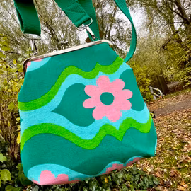 Väska ”Gerbera” med börsknäppe