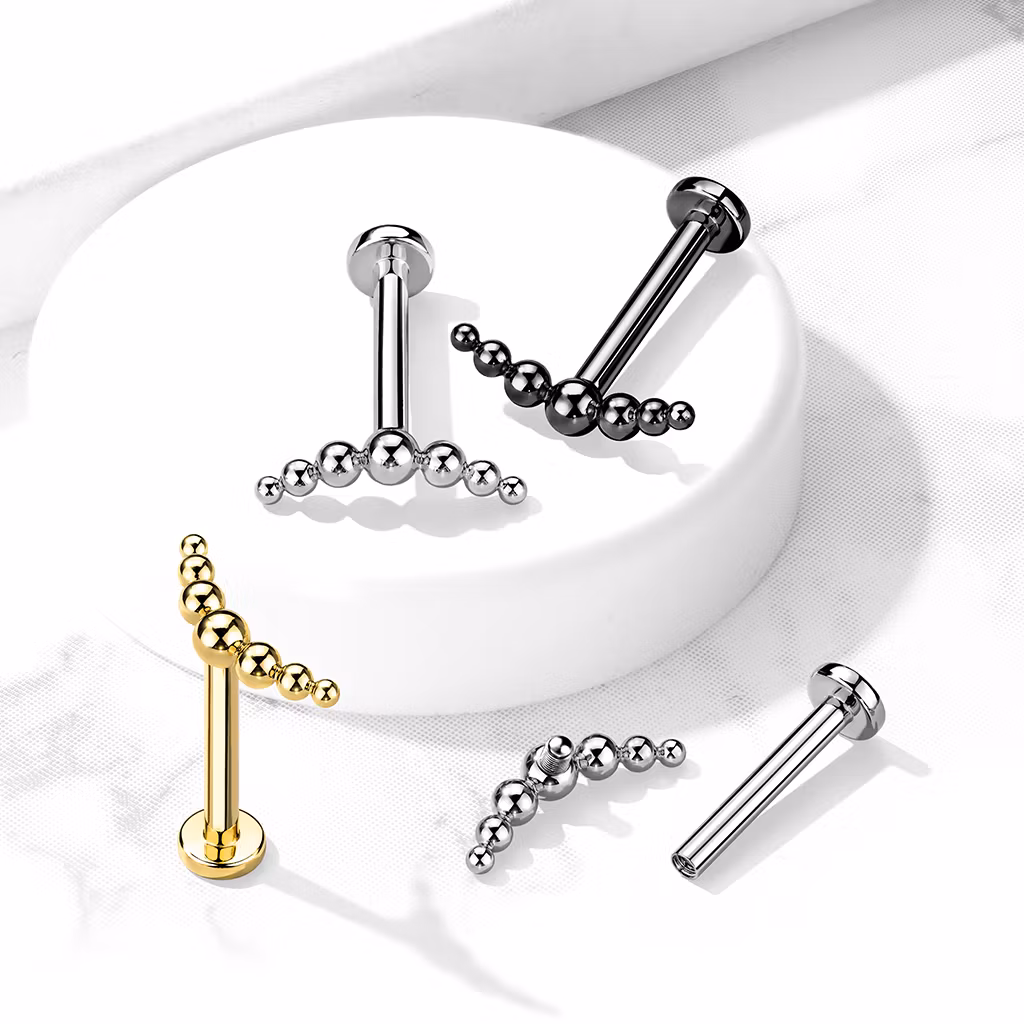 Labret i titanium 1.2mm - Kurvat / böjt bollkluster med 7 kulor