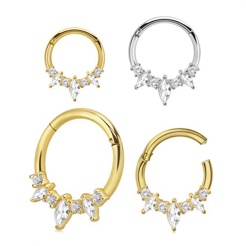 Clicker i kirurgiskt stål med tre navettslipade och fyra runda cubic zirconia
