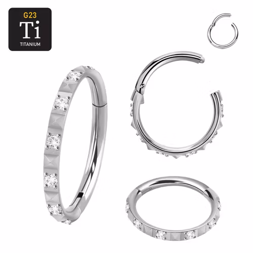 Segmentring 1.2mm i titanium med gångjärn och pyramidslipad front mellan klar cubic zirconia