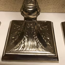 CANDLESTICKS, 3 pieces, metal, early 20th century.