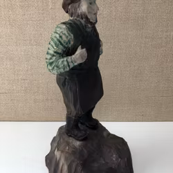 SCULPTURE, wood, blacksmith, dated 1920.