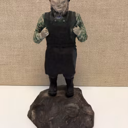 SCULPTURE, wood, blacksmith, dated 1920.