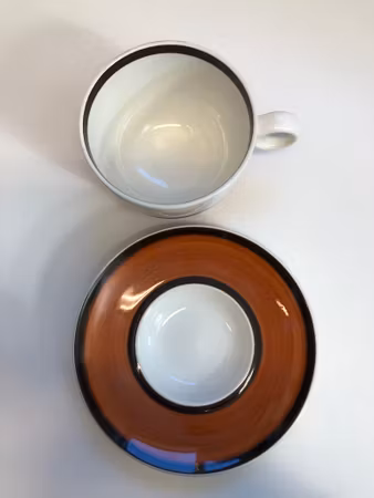 STIG LINDBERG. Teacup with saucer, stoneware, "Arena", Gustavsberg.