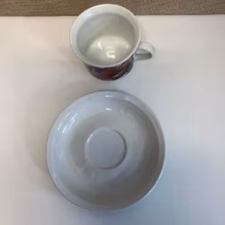 ESTERI TOMULA. Kaffekopp med fat, porslin," Valmu", Arabia, Finland.