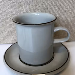 ULLA PROCOPÉ. Coffee cup with saucer, stoneware, "Fennica", Arabia.