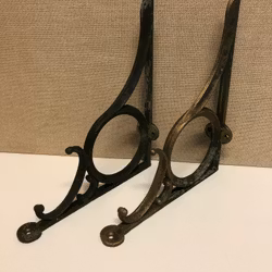 A pair of CONOLES, brass, first half of the 20th century.