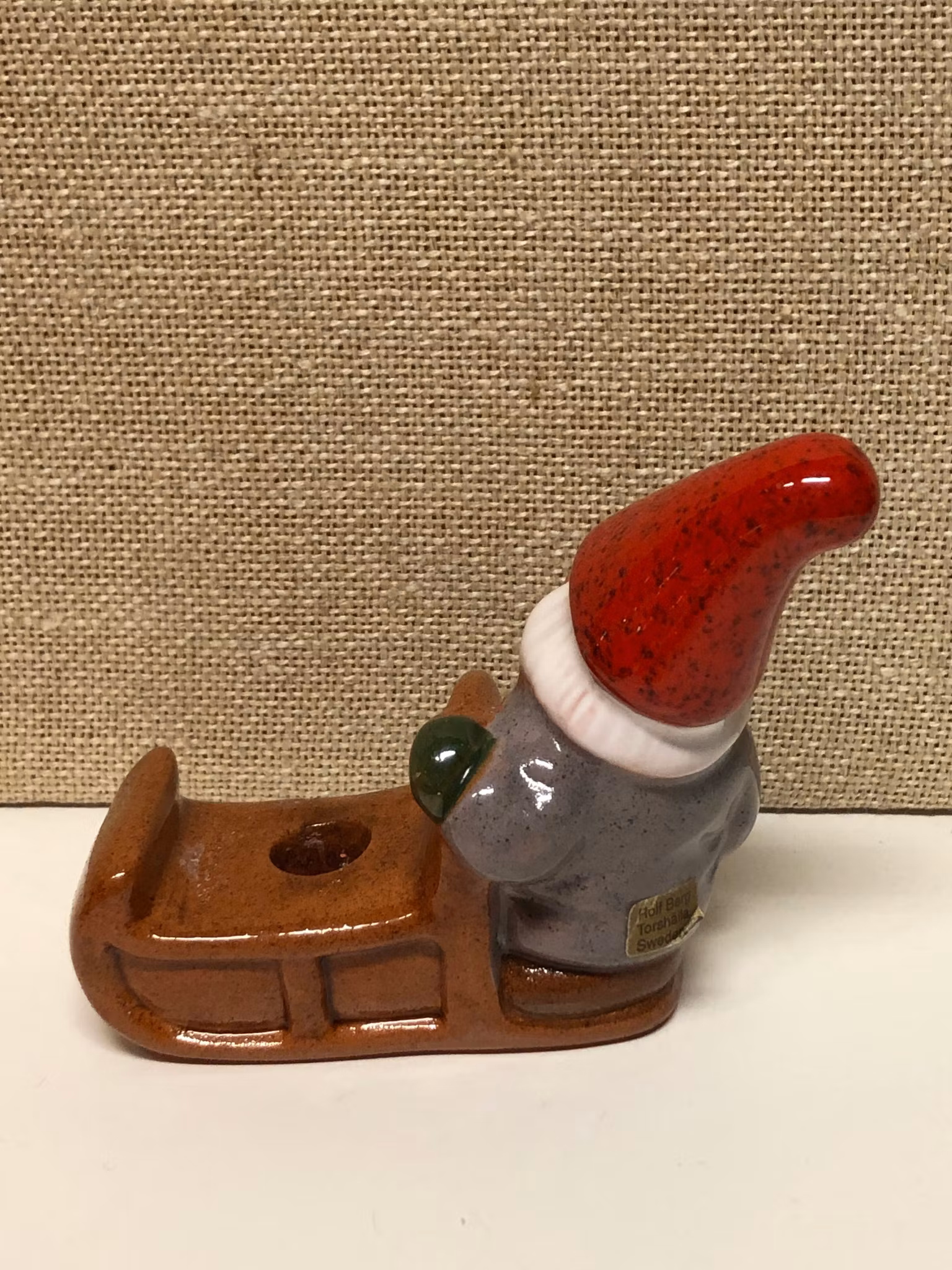 ROLF BERG. Ljusstake, keramik,"Tomte med släde", Torshälla.