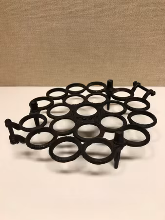 EGG HOLDER, cast iron, Musterschutz, second half of the 20th century.