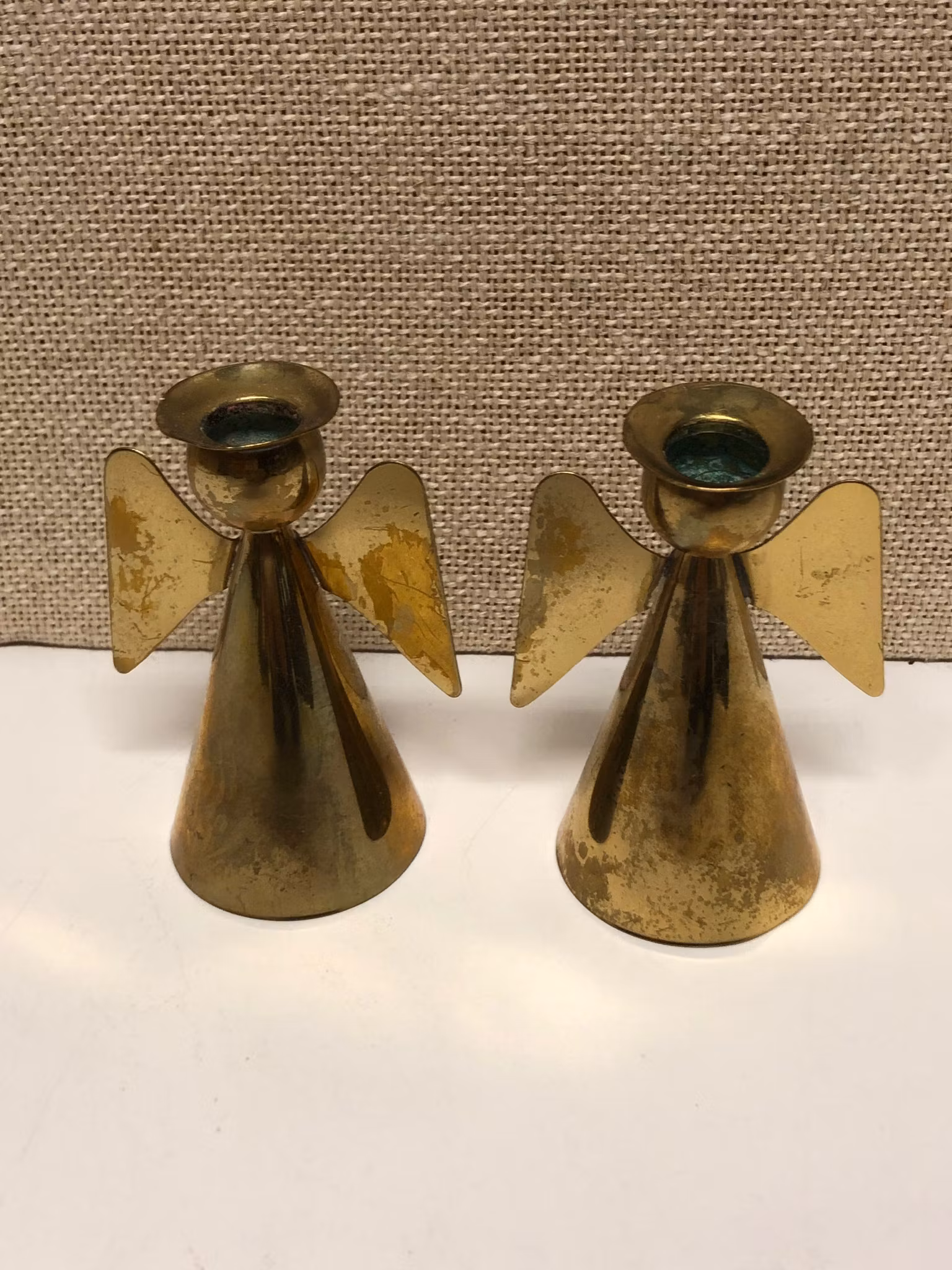 YSTAD METALL, LJUSSTAKAR, ett par, mässing, formad som7 cm. änglar, Sweden, 1900-talets andra hälft.