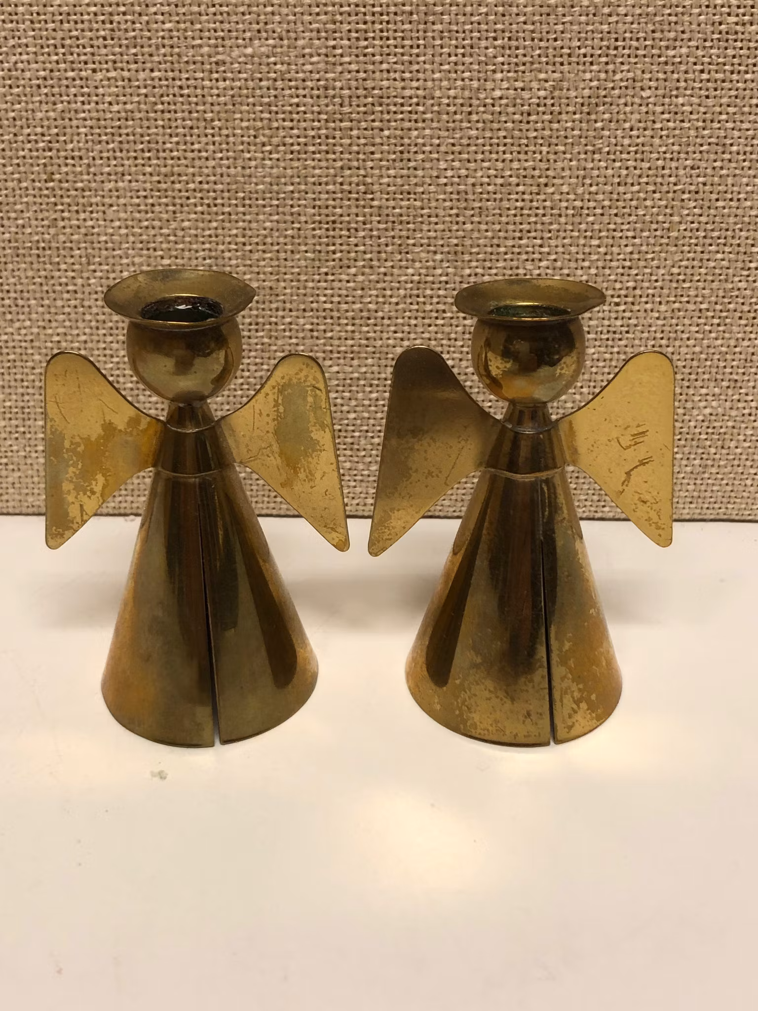 YSTAD METALL, LJUSSTAKAR, ett par, mässing, formad som7 cm. änglar, Sweden, 1900-talets andra hälft.