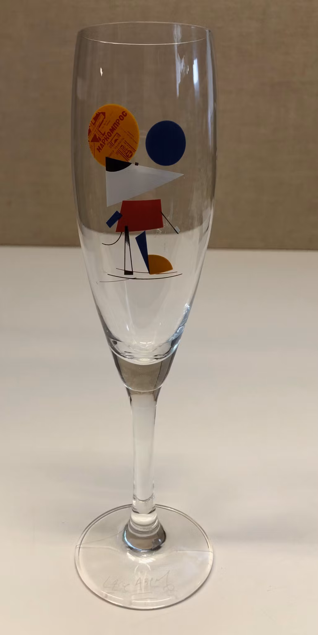 LASSE ÅBERG. Champagneglas, singerad.