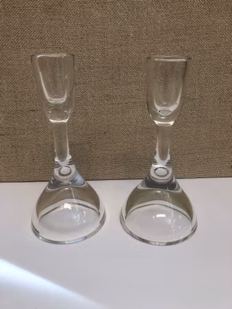 VICKE LINDSTRAND. Candlesticks, a pair, glass, signed, Kosta.