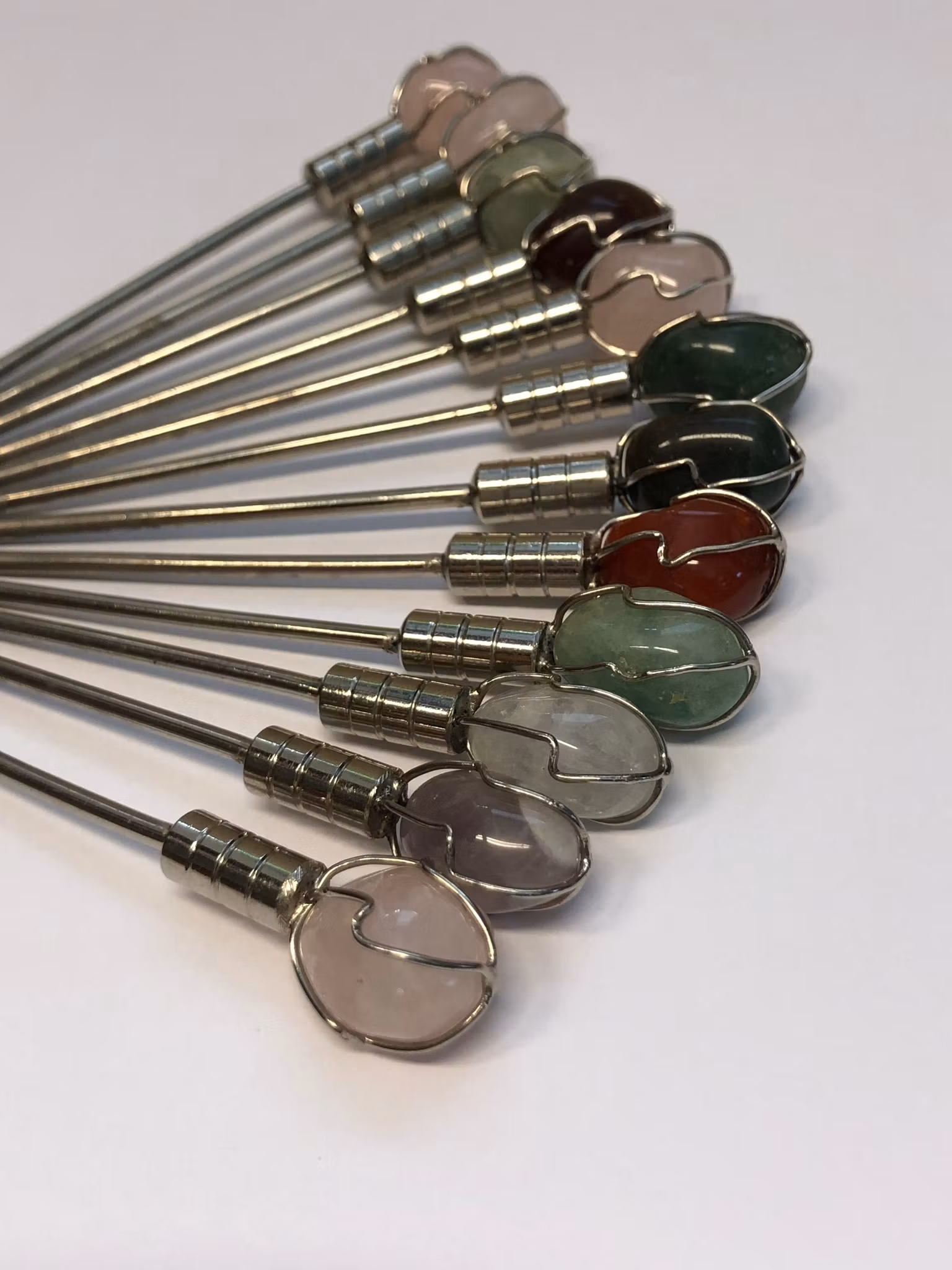 COCKTAILPINNAR 12 st. metall/sten, 1900-talets andra hälft.