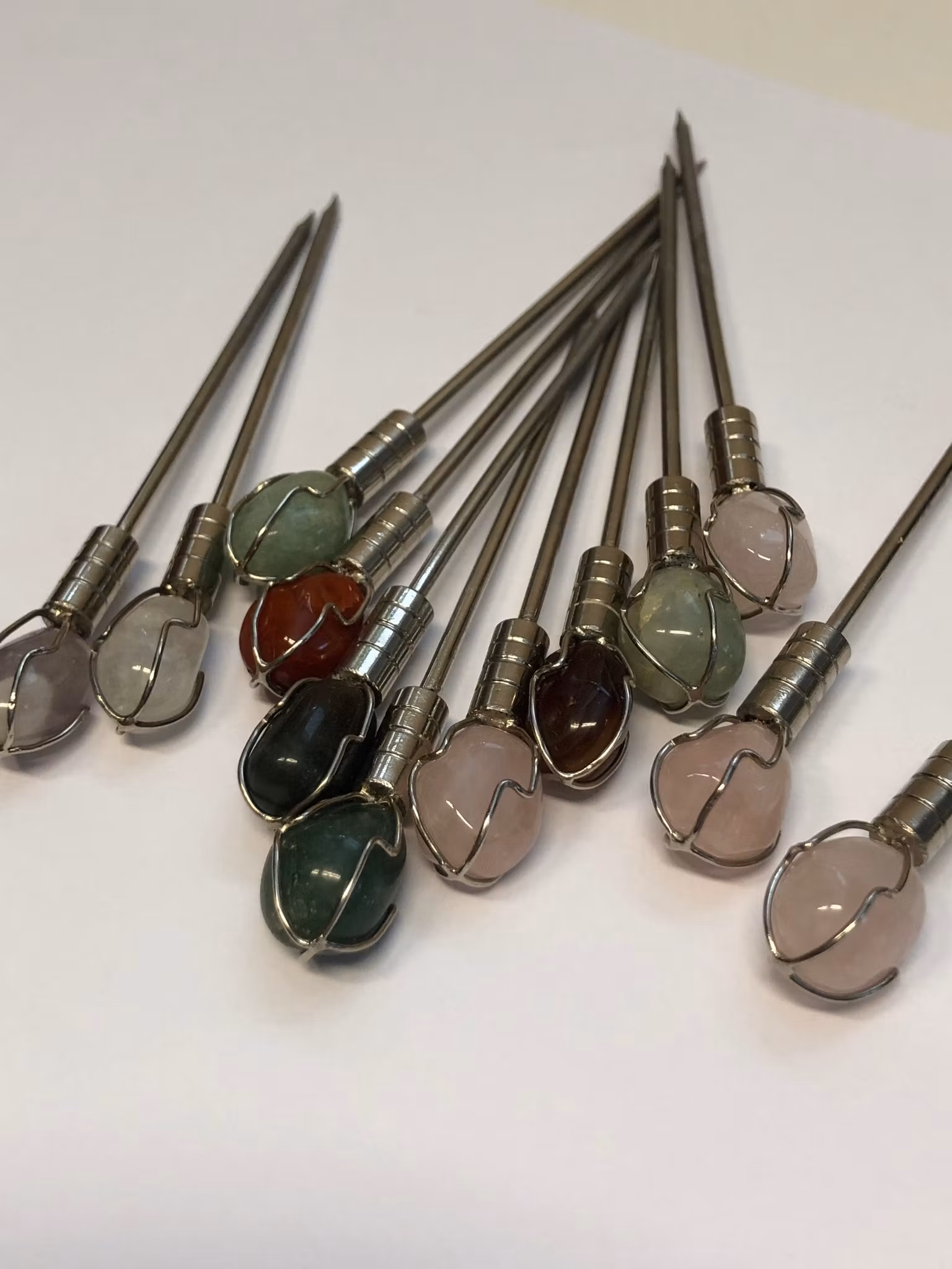 COCKTAILPINNAR 12 st. metall/sten, 1900-talets andra hälft.