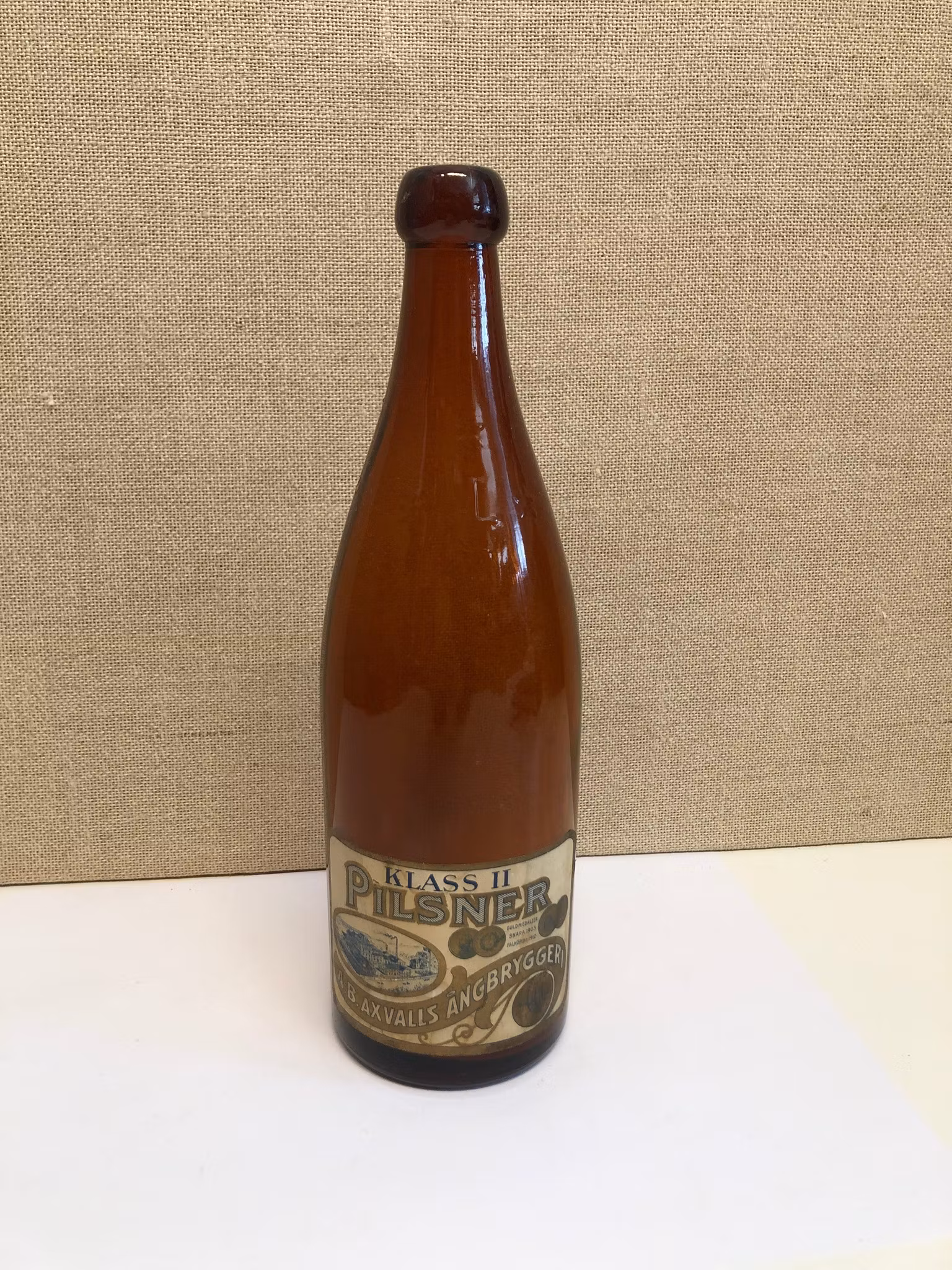 FLASKA, glas, Klass II, Pilsner, A.B. Axvalls Ångbryggeri, 1900-talets första hälft.