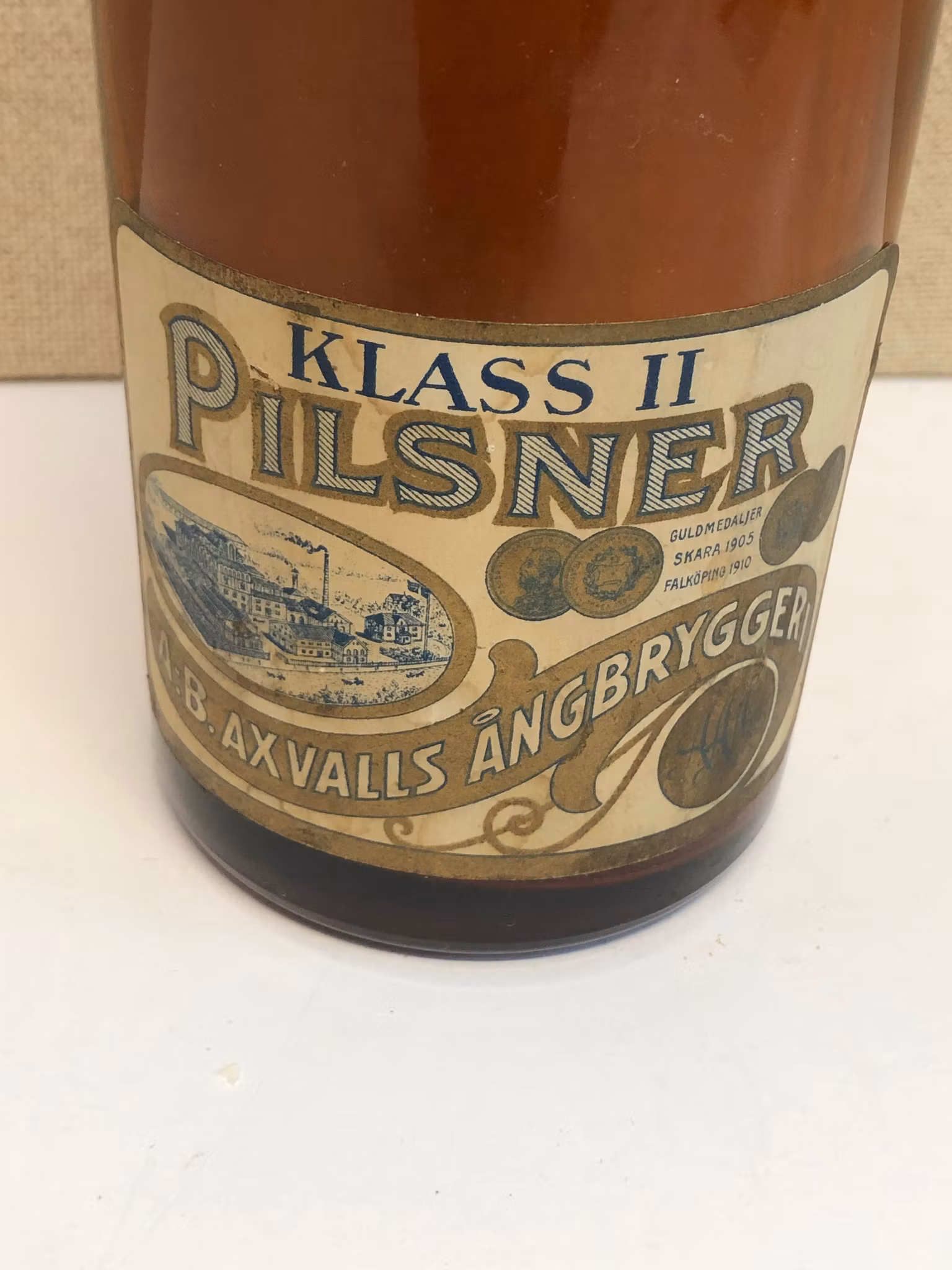 FLASKA, glas, Klass II, Pilsner, A.B. Axvalls Ångbryggeri, 1900-talets första hälft.