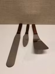 2 STEAK PADDLES AND BUTTER KNIFE, wood/stainless steel, including Karlsson/Nilsson Sweden, 1960s/70s.