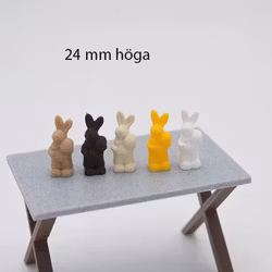 Liten Kanin som håller ägg 24 mm hög