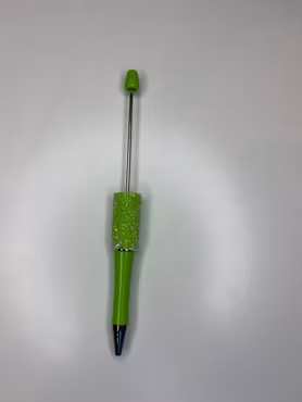 Grön glittrig penna att pärla på