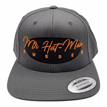 YP6606 Classic Snapback Dark Grey with black front oval and orange text