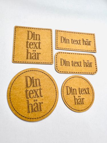 Konstläderlappar/Etiketter med streckad kant - egen text