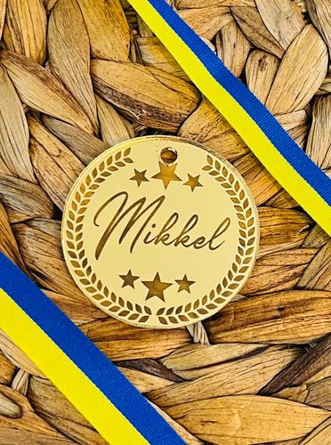 Medalj i guld med eget namn