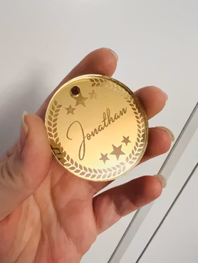 Medalj i guld med eget namn