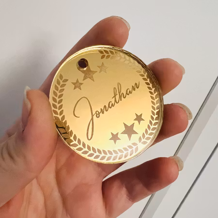 Medalj i guld med eget namn