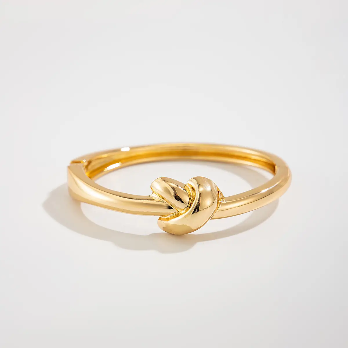 Knytte armband, guld