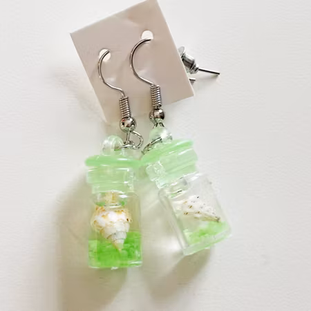 Örhängen burk med snäcka