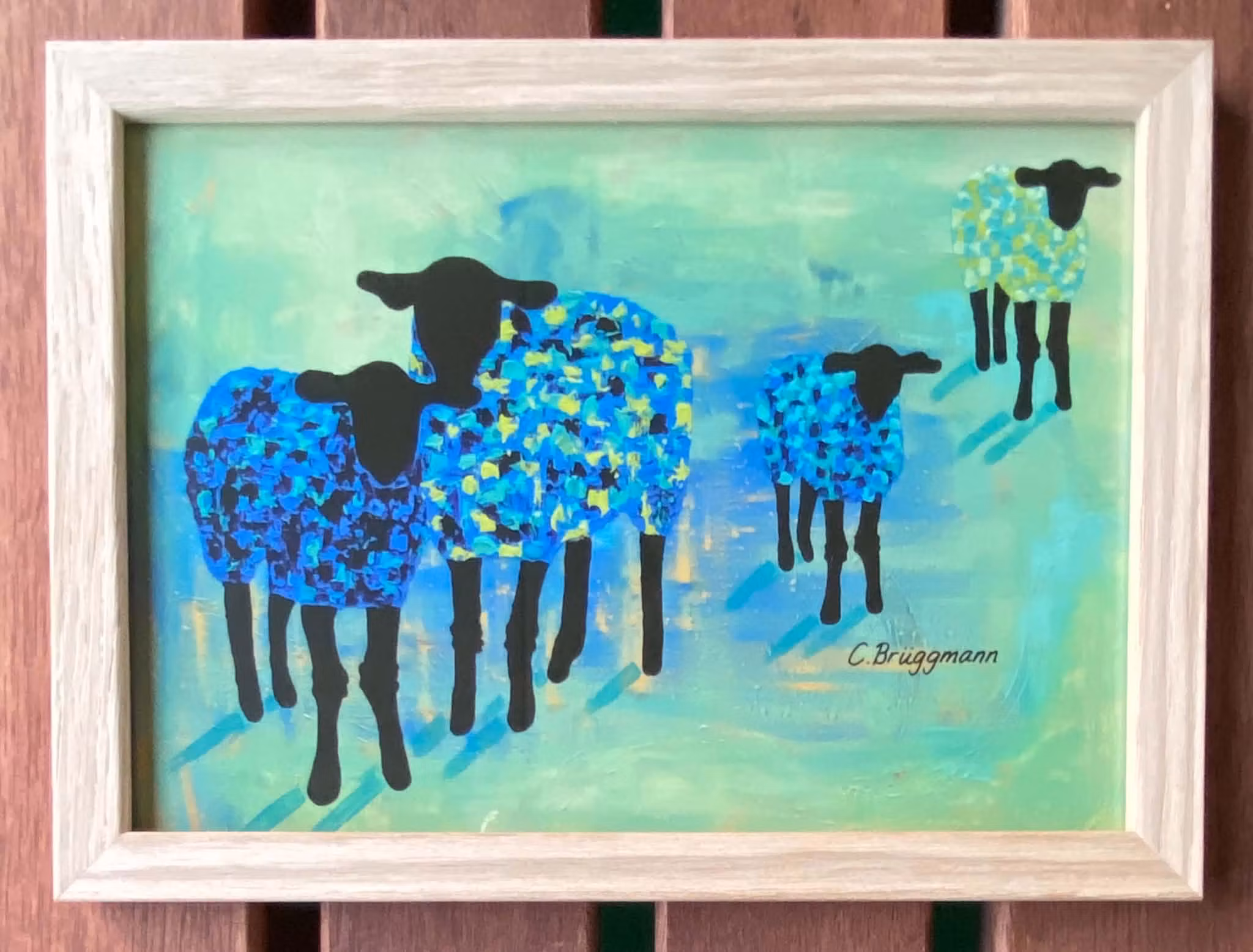 Snygg ram i stl 15x21 cm i obehandlad ek. Motivet är med får i grönt och blått, ett tryck av en originalmålning.