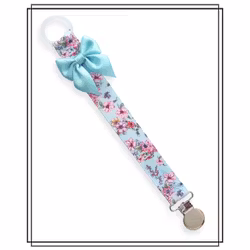 Napphållare med blommor och ljus turkos rosett - silver