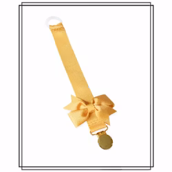 Guldfärgad napphållare med Gerda-rosett