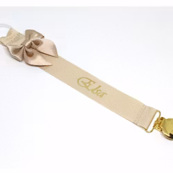 Beige napphållare med rosett - guld