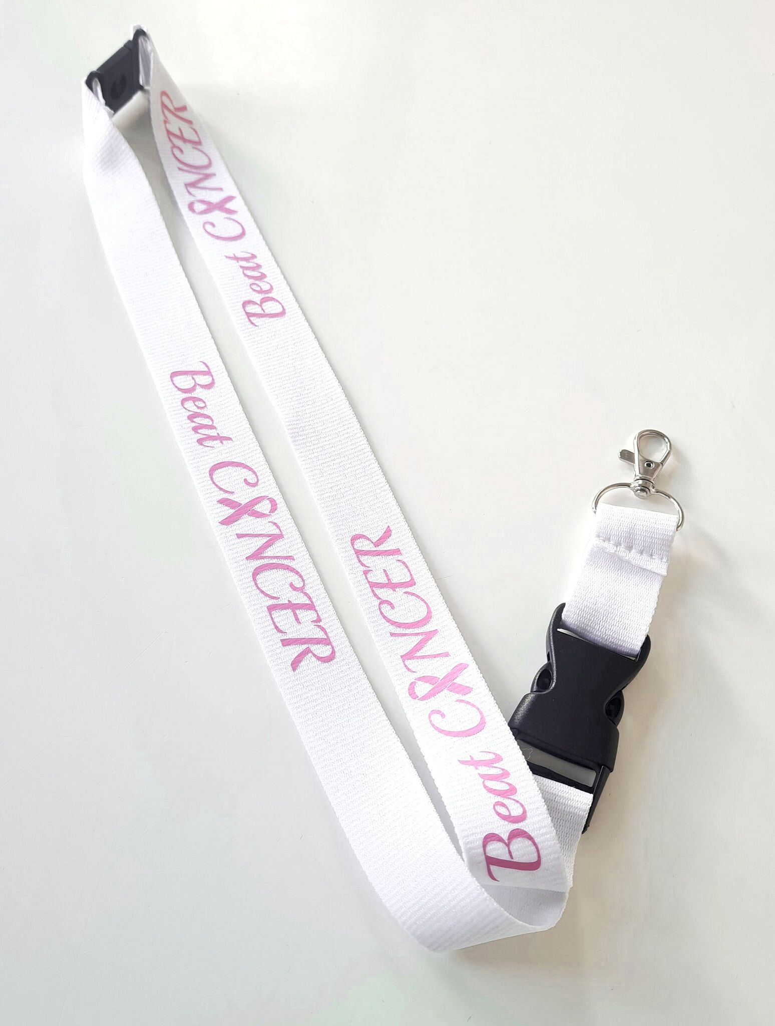Nyckelband "Beat CANCER" rosa bandet - vitt