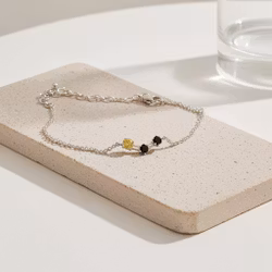 Armband svart och gult silver