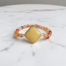 Armband orange gula stenar