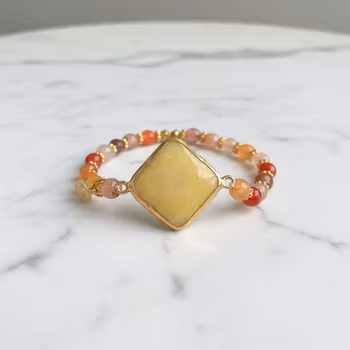 Armband orange gula stenar