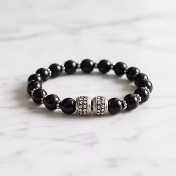 Killarmband svarta pärlor