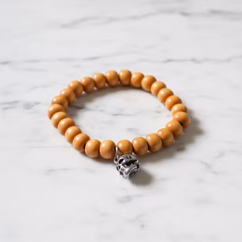 Orange armband i trä herr