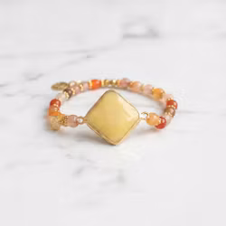 Armband orange gula stenar