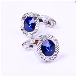 Manschettknappar med blå sten och strukturerad ram