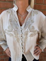 Beige blus gulddetaljer