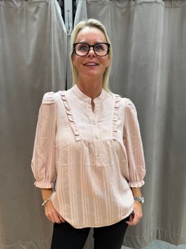 Rosa blus med krås