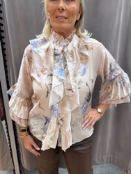 Beige volangblus med fågelmönster
